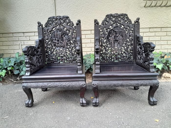 An Early 20th Century Circa 1920 Pair of Oriental Ornately Carved Throne Chairs