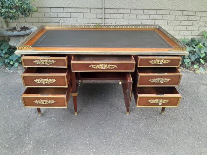 A 20th Century French Empire Style Mahogany Desk with Leather and Gilt Tooling Writing Surface and Brass Gallery - Image 7