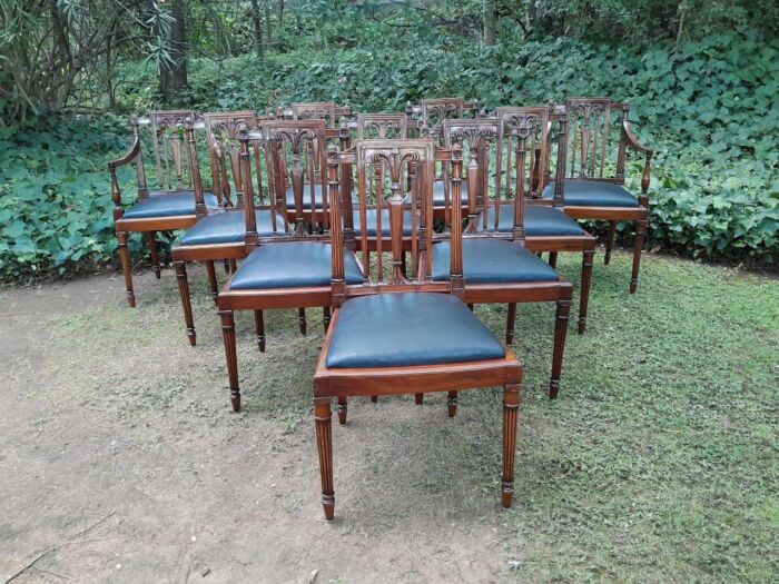 A 20th Century George III Hepplewhite Style Set of Ten Dining Chairs Comprising a Pair of Carvers/Armchairs and Eight Dining Chairs in a Contemporary Bleached Finish and Upholstered in Leather 