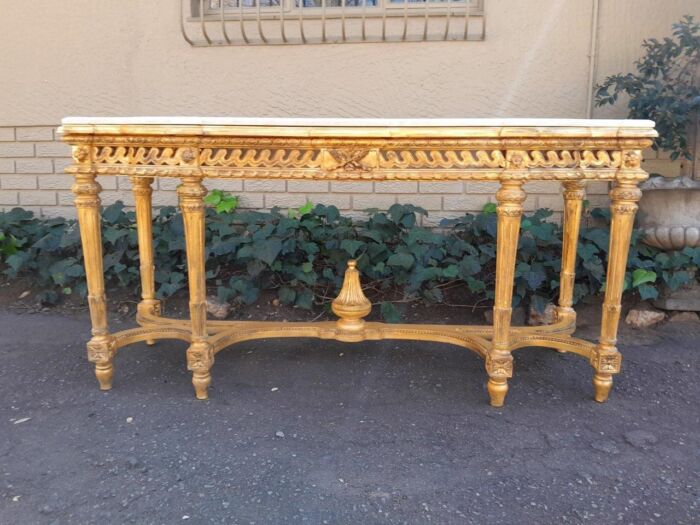 A 20th Century French Louis SVI Style Hand Gilded Console Table With Cream Marble Top