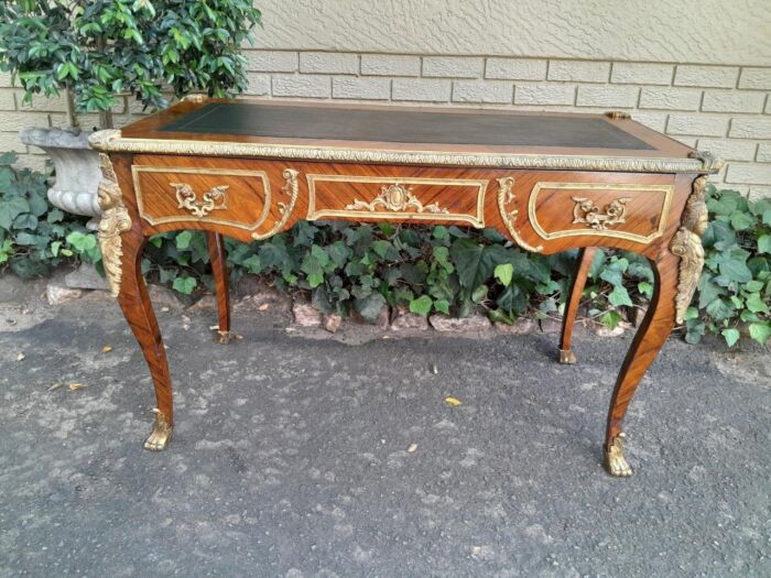 A Middle 20th Century French Louis XVI Style Rosewood Bureau / Plat / Desk With Gilt and Tooled Black Leather Writing Surface with Cast Brass Mounts and Drawer