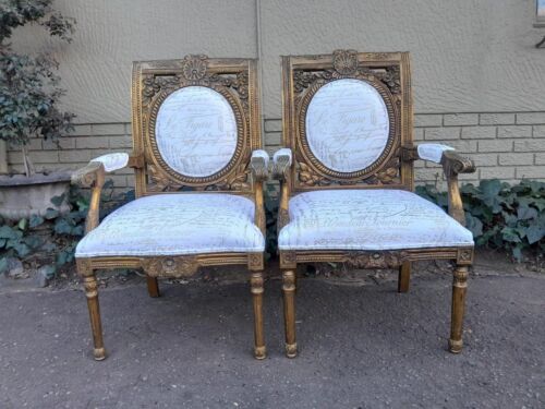 An Early 20th Century Pair Of French Louis Xiv Style Ornately Carved And Gilt Wooden Armchairs