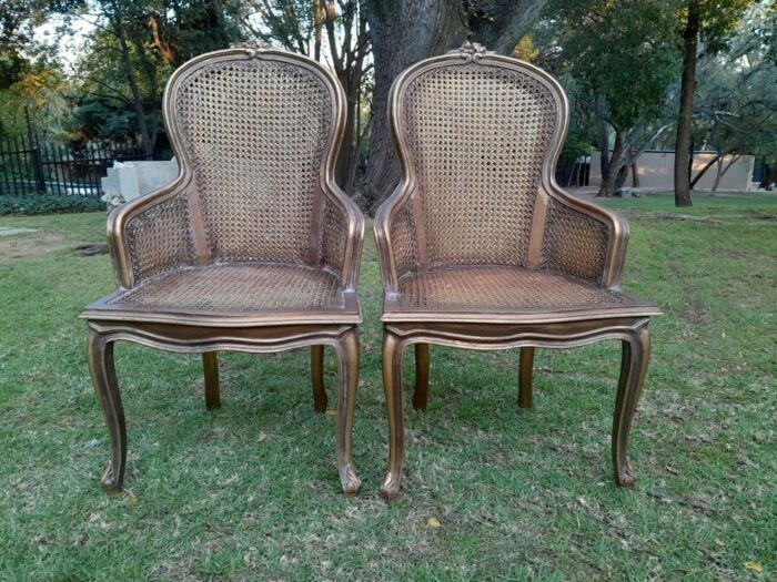 A Pair of French Style Ornately Carved and Gilded Rattan High Back Armchairs - Image 10