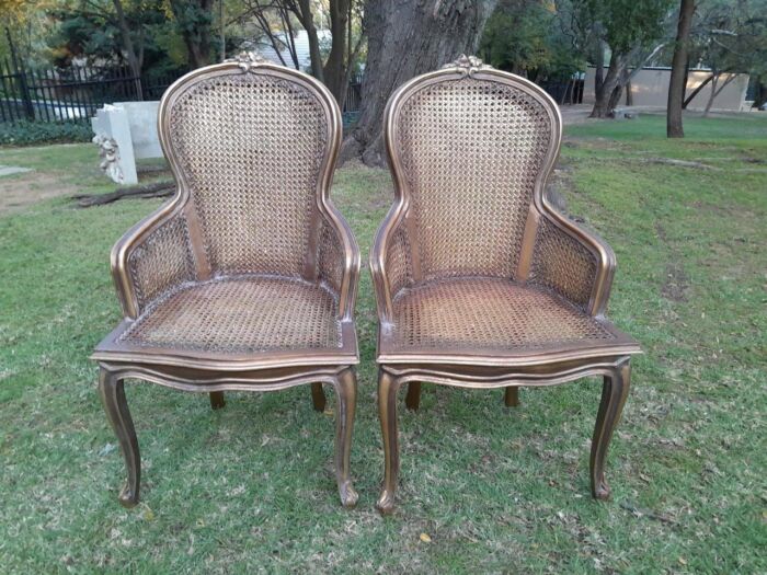 A Pair of French Style Ornately Carved and Gilded Rattan High Back Armchairs - Image 11