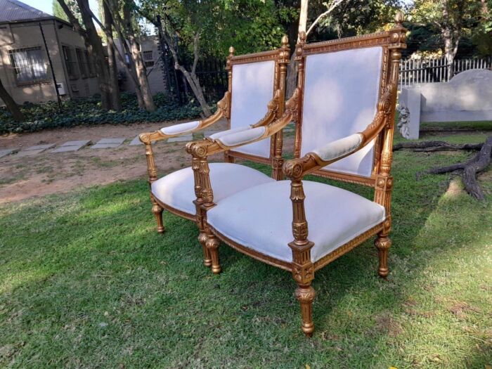 A Pair of French Style Ornately Carved Giltwood Arm Chairs - Image 2