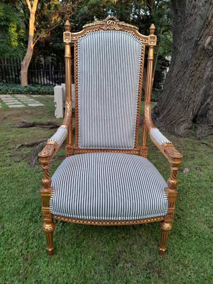 A Pair of French Rococo Style Ornately Carved Giltwood Arm Chairs Upholstered in a Contemporary Ticking Fabric - Image 5