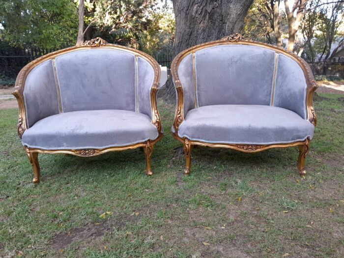 A Pair of French Ornately Carved and Gilded Bergere Chairs - Image 2