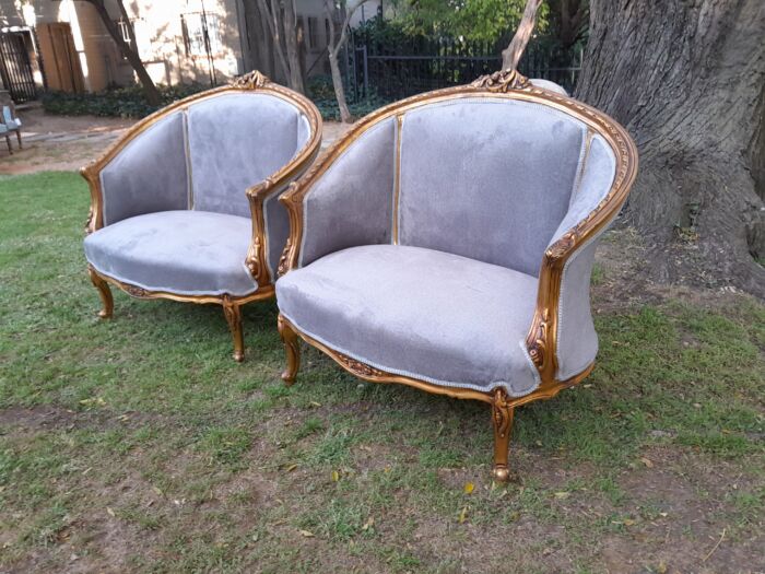 A Pair of French Ornately Carved and Gilded Bergere Chairs - Image 3