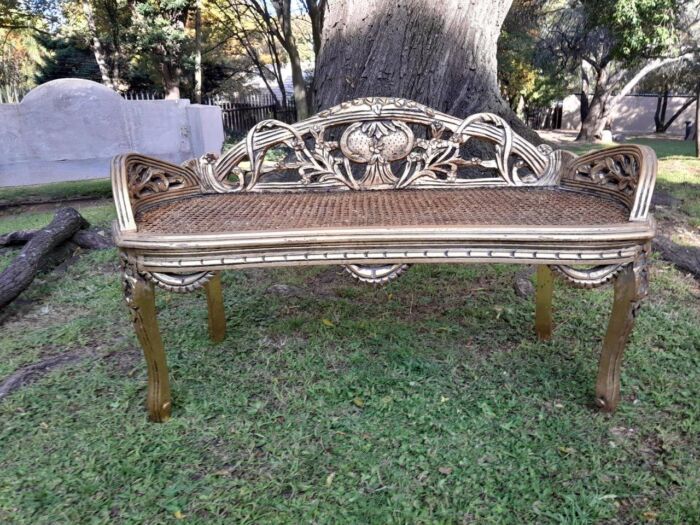 A French Style Ornately Carved and Hand- Gilded Rattan Bench / Settee