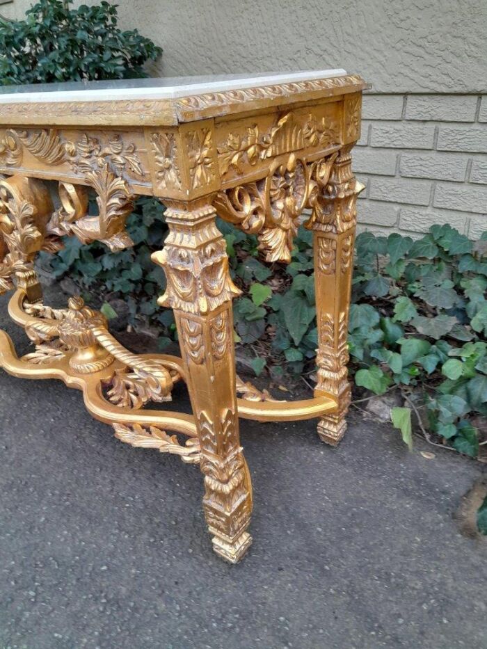 A 20th Century Ornately Carved and Hand-Gilded Console Table with Cream Marble Top - Image 6