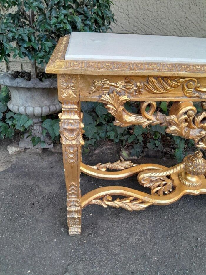 A 20th Century Ornately Carved and Hand-Gilded Console Table with Cream Marble Top - Image 7