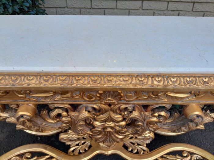 A 20th Century Ornately Carved and Hand-Gilded Console Table with Cream Marble Top - Image 10