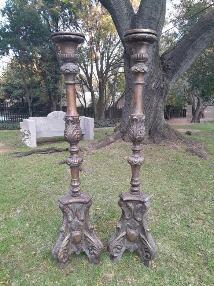 A Pair of French Style Carved and Gilded Floor or Table Candle Holders