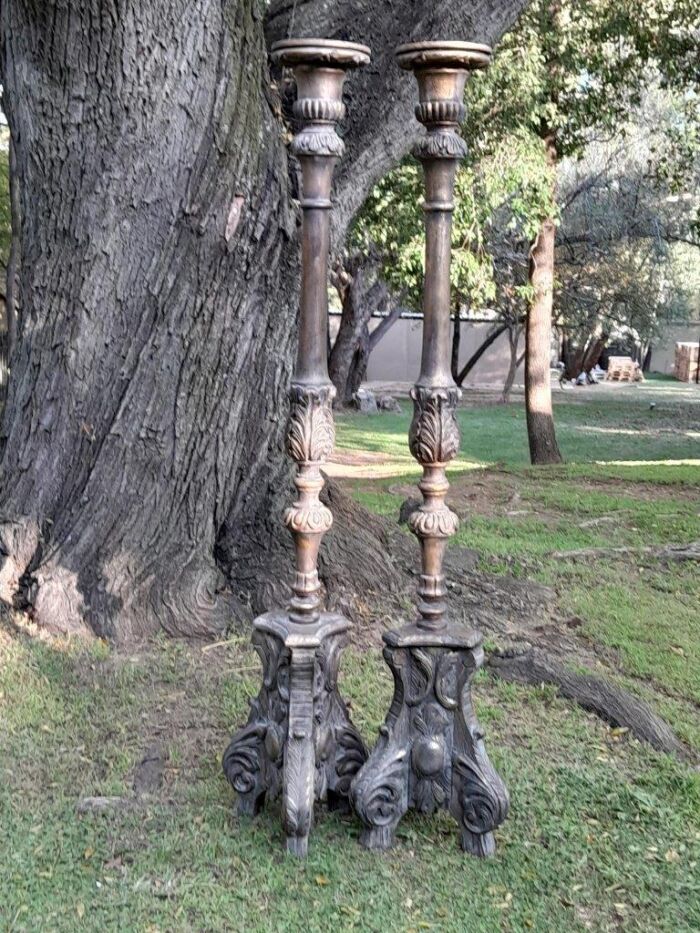 A Pair of French Style Carved and Gilded Floor or Table Candle Holders