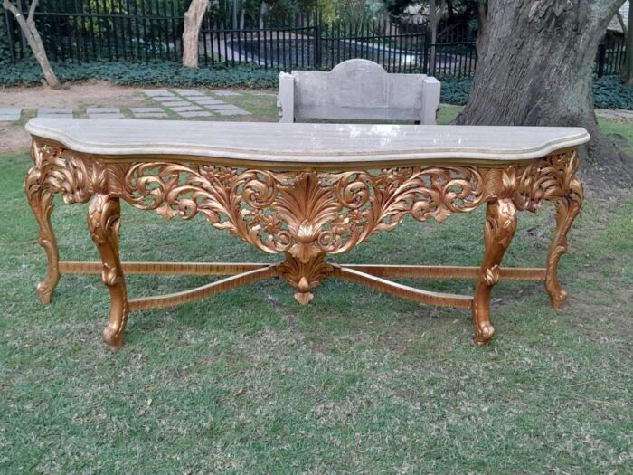 A 20th Century Ornately Carved and Hand-Gilded Console Table of Large Proportion with Cream Marble Top - Image 4