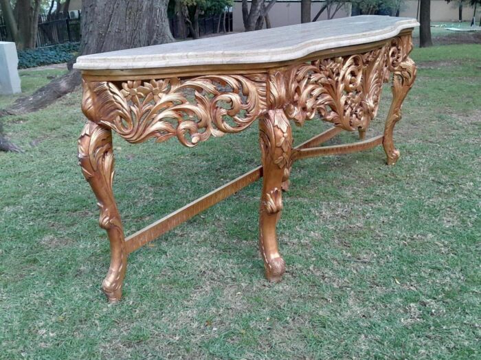 A 20th Century Ornately Carved and Hand-Gilded Console Table of Large Proportion with Cream Marble Top - Image 6