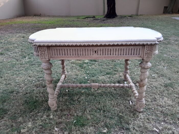 An Antique 20th Century French  Ornately Carved Console / Drinks Table with Drawer in a Contemporary Bleached Finish with Marble Top