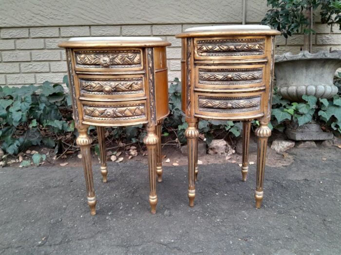 A Pair Of French Style Hand-Gilded Round Pedestals / Side Tables With Drawers And Cream Marble Tops - Image 2