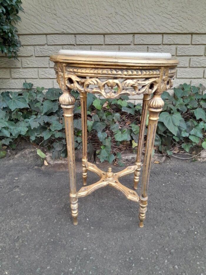 A 20th Century French Style Carved and Hand Gilded Side Table with Marble Top