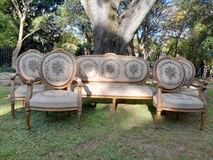 A 20th Century French Louis XVI Style Set of a Carved and Gilded Settee and Four Armchairs with Tapestry Fabric Settee