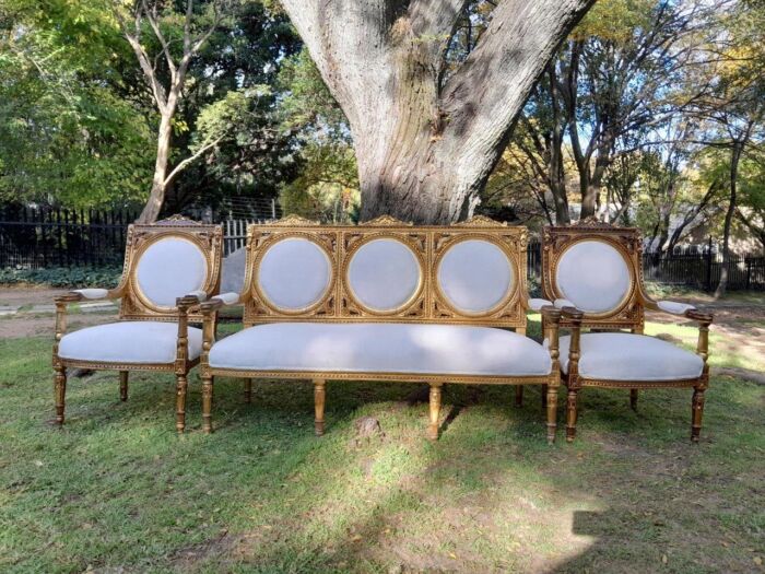 A 20th Century French Style Ornately Carved Gilt Wood Set Comprising a Settee and Pair of Armchairs