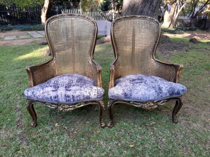 A 20th Century Pair of French Style Gilt Wood Rattan Arm Chairs