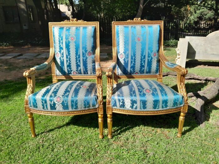 A 20th Century French Style Pair of Gilt Wood Arm Chairs