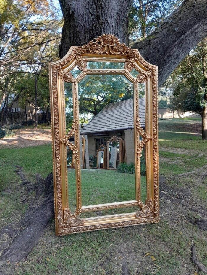 A French Rococo Style Ornately Carved & Gilded Bevelled Mirror