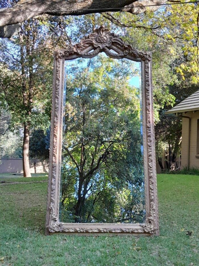 A French Rococo Style Ornately Carved & Gilded Bevelled Mirror