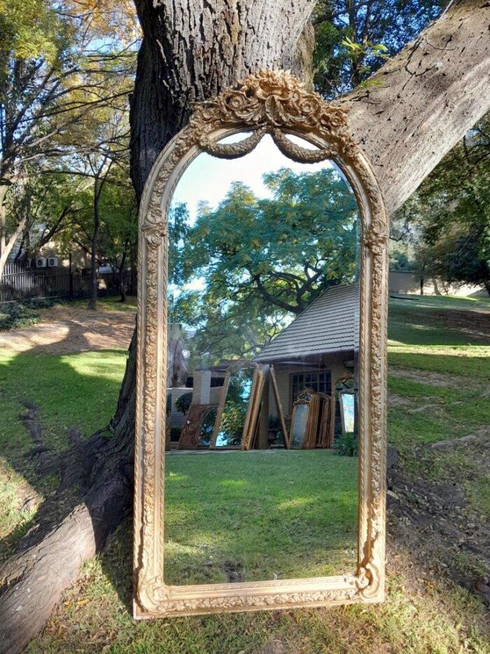 A French Rococo Style Ornately Carved & Gilded Bevelled Mirror