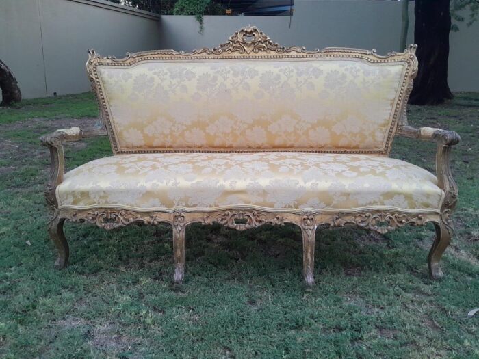 A 20th Century Circa 1950 French Style Ornately Carved Giltwood Settee