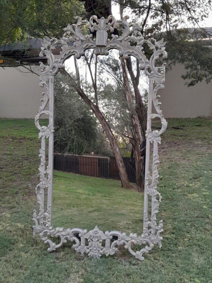 A 20th Century French Style Carved Grey and Gilded Mirror