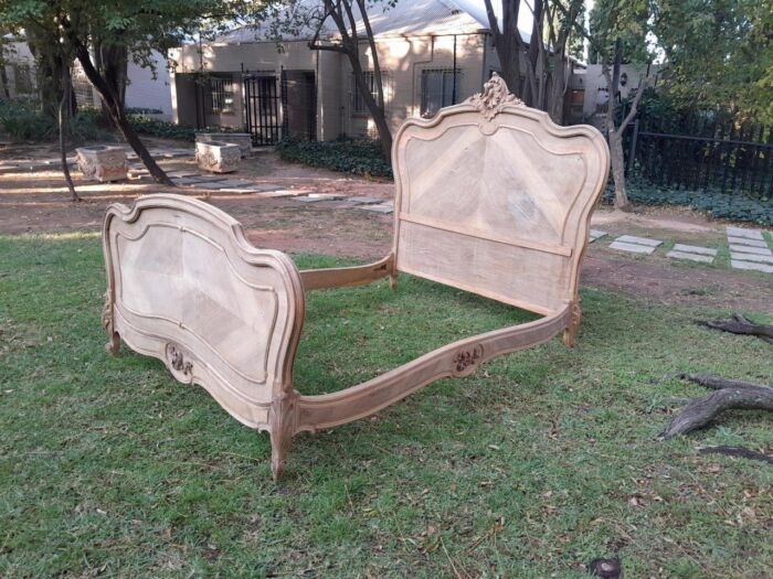 A 20TH Century Walnut Rococo Style Bed in a Contemporary Bleached Finish