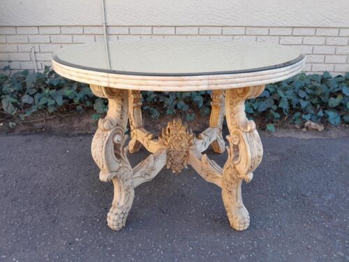 A 20th Century Ornately Carved Circular Wooden Table In A Contemporary Bleached Finish And With A Bevelled Mirror Top