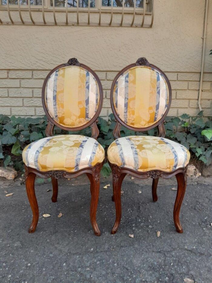 A Pair Of 19th Century French Carved Walnut Chairs