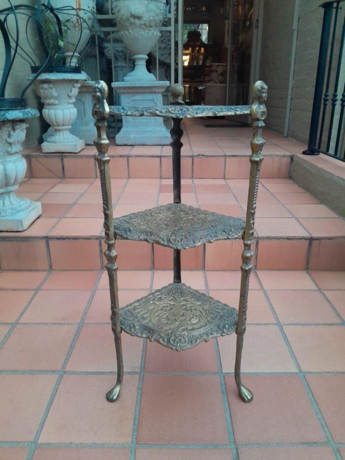 A 20th Century Chinoiserie Brass Stand On Paw Feet