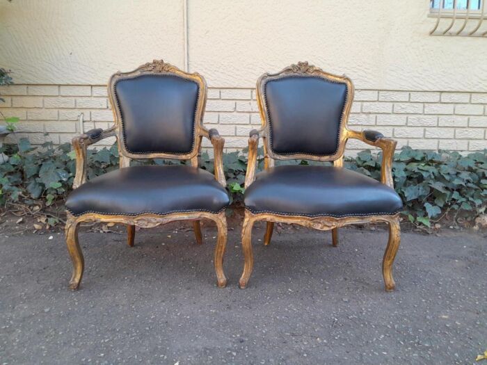 An Early 20th Century Pair of French Giltwood Bergere Armchairs Upholstered in Leather