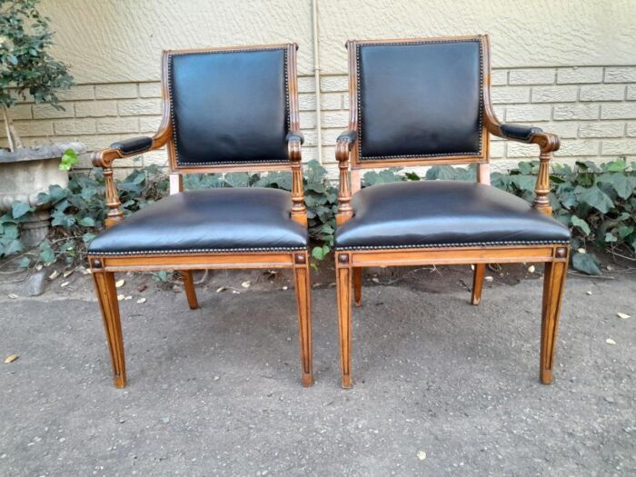 Pair Of A 20th Century French  Style Walnut Armchairs Upholstered In Leather