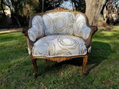 A Late 19th Century French Carved and Gilt Wood Walnut Bergere Armchair  Upholstered in  a custom made fabric for The Crown Collection