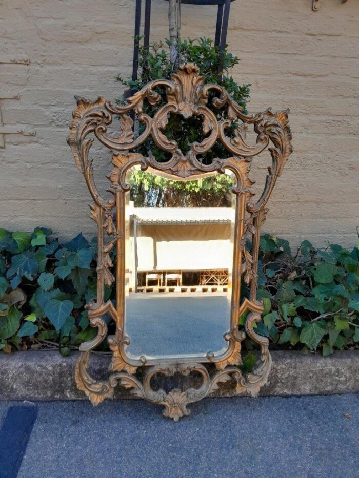 A 20th Century French Style Ornately Carved And Gilt Painted Wooden Mirror