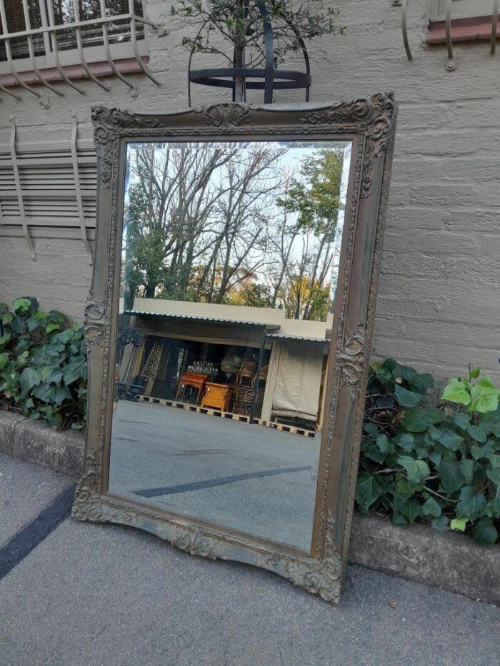 A 20th Century Large And Ornately Carved Gilded And Bevelled Mirror - Image 5