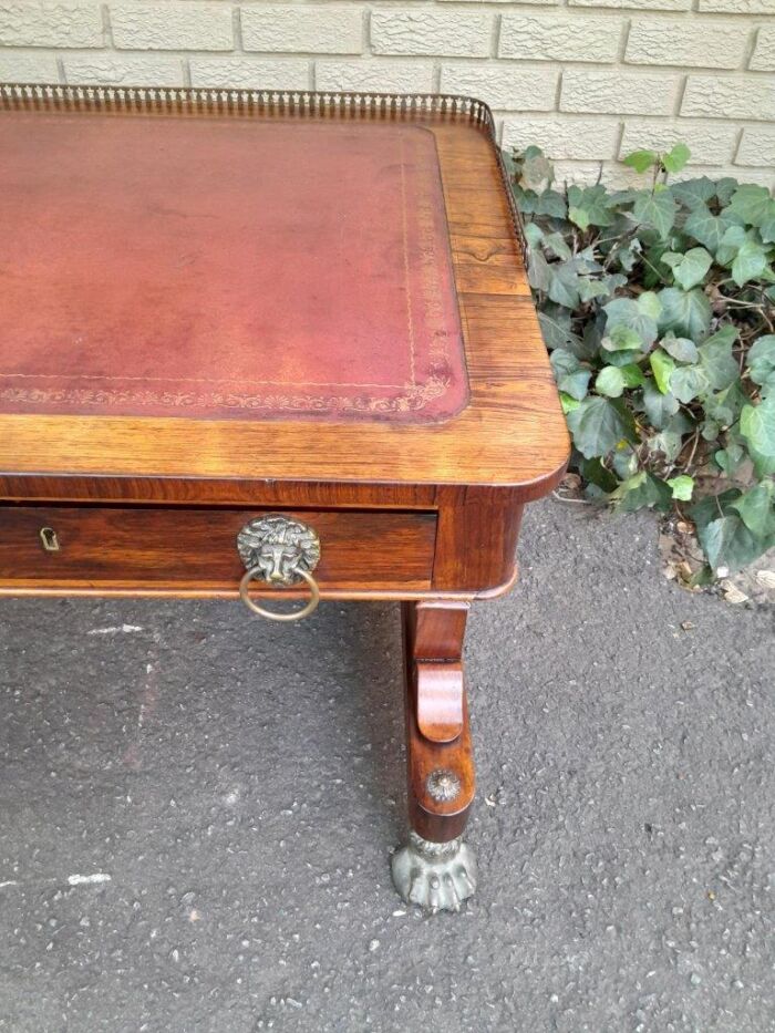 A 19th Century William IV Rosewood Desk with Gilt Tooled Leather and Gilt Metal Gallery Top on Bronze Lion Claw Feet - Image 10