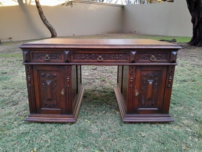 A 20th Century Ornately Carved Oak Pedestal Desk with Drawers - Image 2