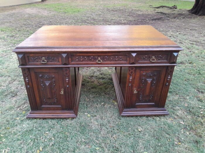 A 20th Century Ornately Carved Oak Pedestal Desk with Drawers - Image 3