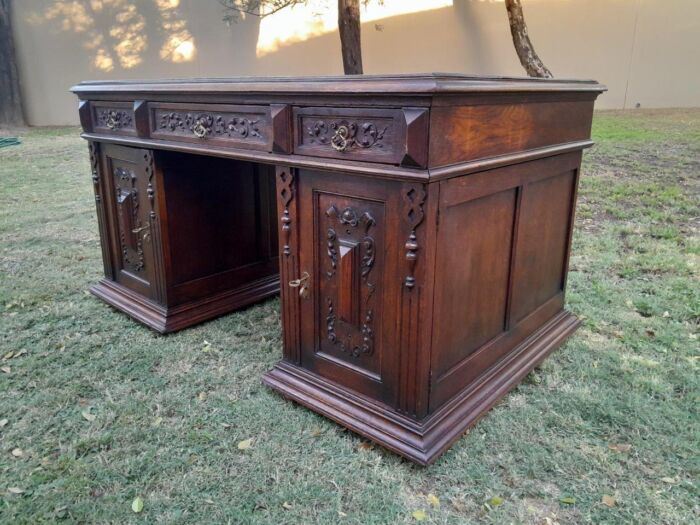 A 20th Century Ornately Carved Oak Pedestal Desk with Drawers - Image 4