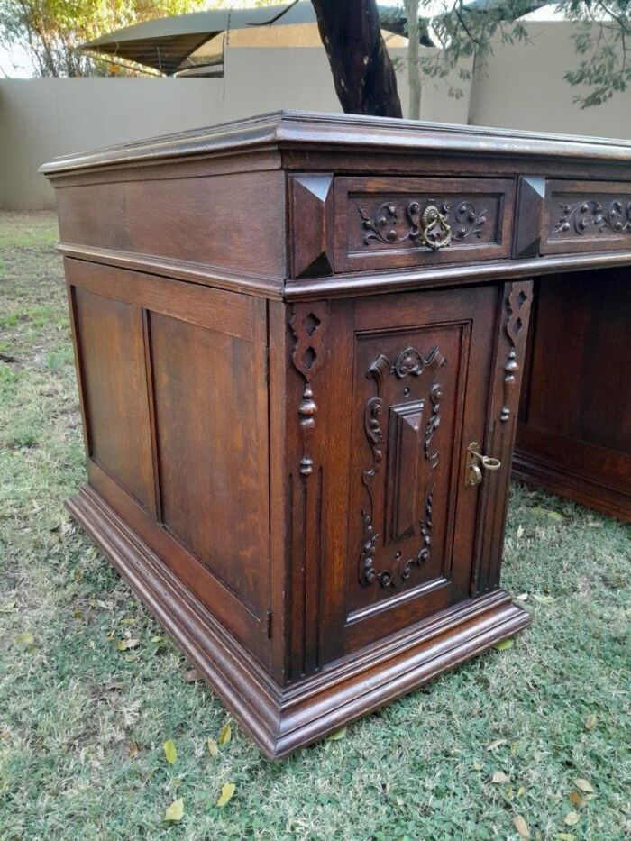 A 20th Century Ornately Carved Oak Pedestal Desk with Drawers - Image 7