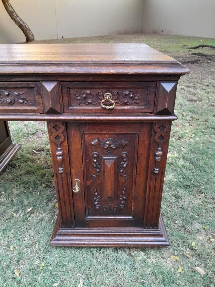 A 20th Century Ornately Carved Oak Pedestal Desk with Drawers - Image 8