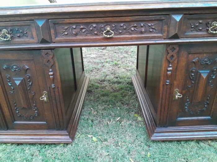 A 20th Century Ornately Carved Oak Pedestal Desk with Drawers - Image 9