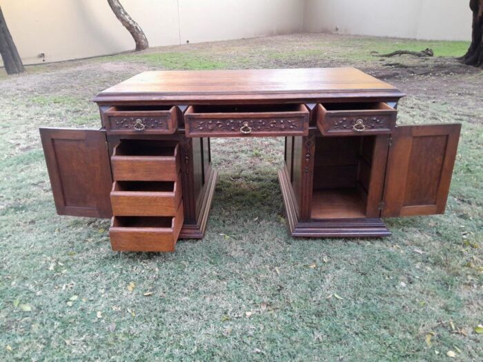 A 20th Century Ornately Carved Oak Pedestal Desk with Drawers - Image 10