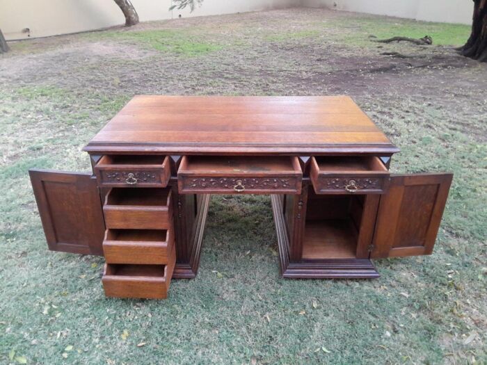 A 20th Century Ornately Carved Oak Pedestal Desk with Drawers - Image 11